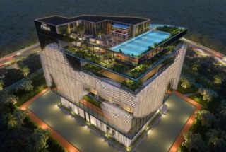 Living room with orange sofa and wooden partition